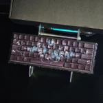 Bone Blade keycaps feature unique side-lit PBT artistry for mechanical keyboards. Sharp icy aesthetics and delicate floral accents appear from various angles.