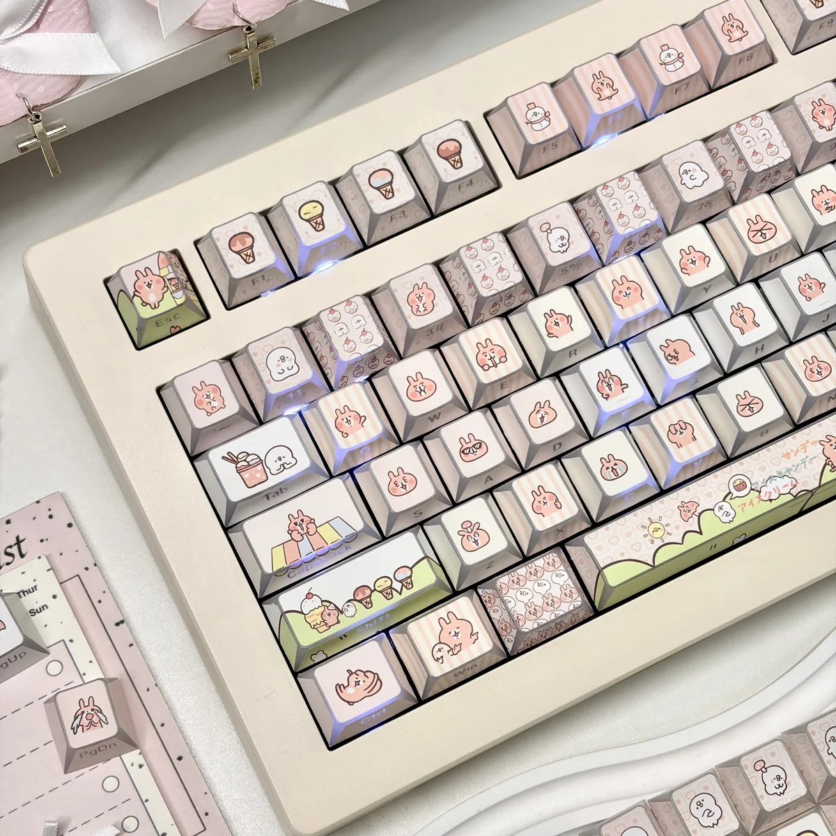 A full set of whimsical bunny PBT keycaps set featuring adorable ice cream designs, displayed from multiple playful angles.