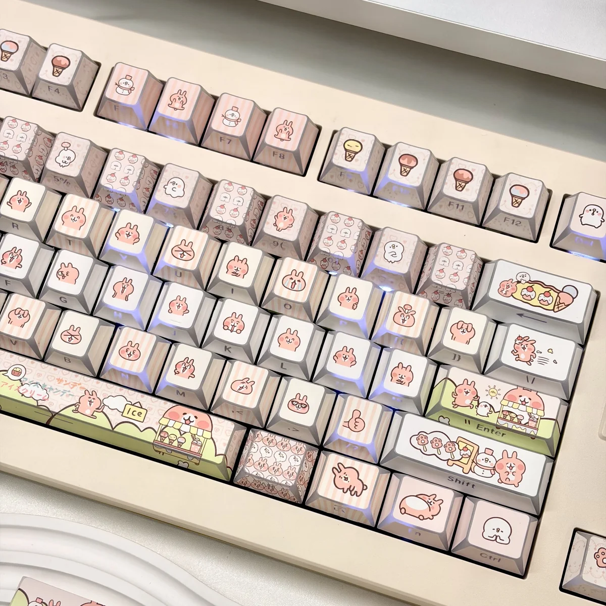 Whimsical Bunny Ice Cream PBT keycaps set with bunny and pink ice cream motifs from various angles for a playful keyboard.