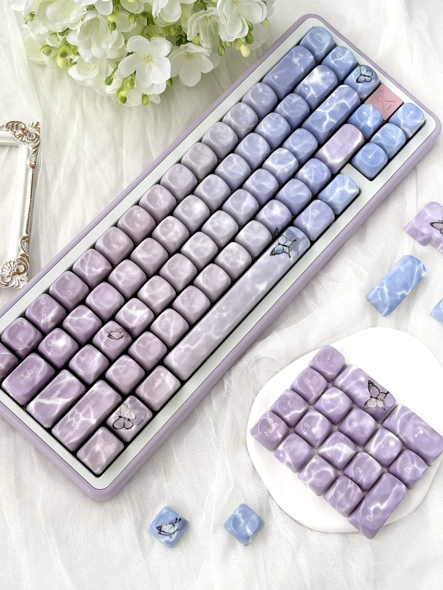 Ethereal Butterfly Keycap Set close-up, revealing the luxurious jade-like feel and poetic glimmer of delicate butterfly motifs from a unique angle.