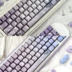 Stunning butterfly keycaps set with a luxurious jade-like feel, displaying a poetic glimmering butterfly design and ethereal aesthetic.