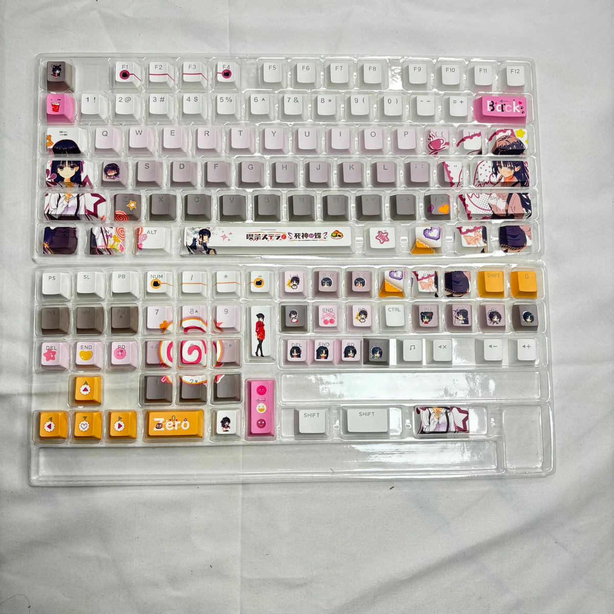 Cafe Stella and the Reaper's Butterflies Shiki Natsume PBT backlit keycaps set from multiple artistic angles, highlighting the dreamy anime character art and translucent legends.