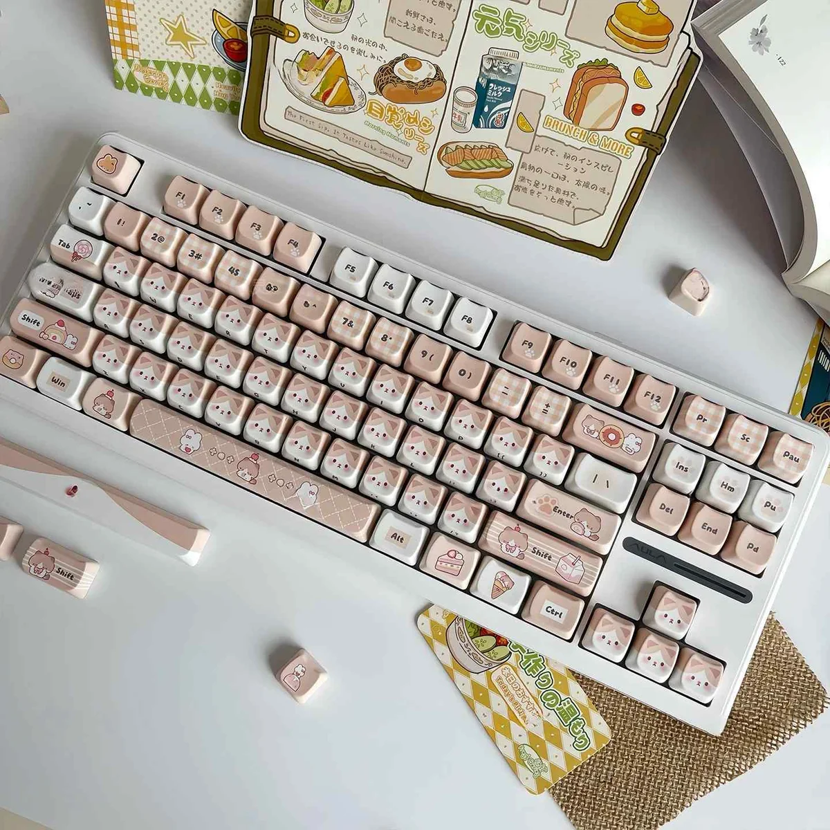 Adorable caramel cat PBT artisan keycap from various angles, showcasing its whimsical feline design, warm tones, and unique MOA profile.