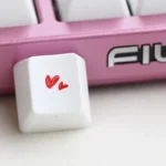 Premium dual-heart PBT keycap gallery, highlighting the durable PBT and elegant romantic design from multiple angles, symbolizing love and quality.