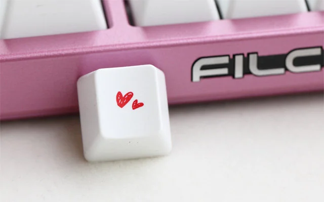 Premium dual-heart PBT keycap gallery, highlighting the durable PBT and elegant romantic design from multiple angles, symbolizing love and quality.