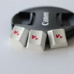 A collection of premium Dual-Heart PBT Keycaps from various angles, showcasing the durable PBT material and elegant romantic dual heart design.