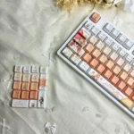 Charming Mahiru Shiina PBT backlit keycaps, showcasing angelic aesthetics and luminous glow. Detailed view highlights premium craftsmanship and durable material.
