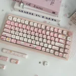 Adorable whimsical pink and white Chiikawa PBT dye-sub MOA keycaps, shown from various angles, perfect for a charming desk aesthetic.