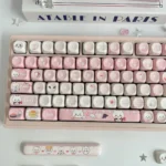 Adorable Chiikawa pink MOA PBT dye-sub keycaps from various angles, featuring whimsical characters for a playful desk aesthetic.