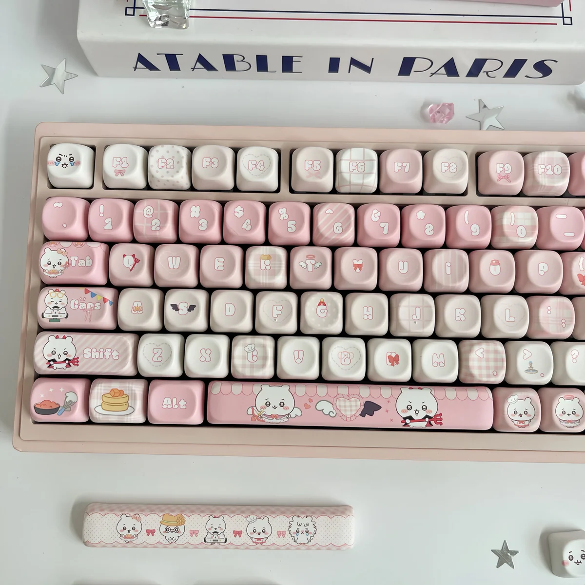 Adorable Chiikawa pink MOA PBT dye-sub keycaps from various angles, featuring whimsical characters for a playful desk aesthetic.