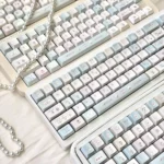 Cloud Sheep Keycaps: multiple angles of dreamy pastel clouds and playful sheep, showcasing milky smooth textures, versatile comfort, and charming design.