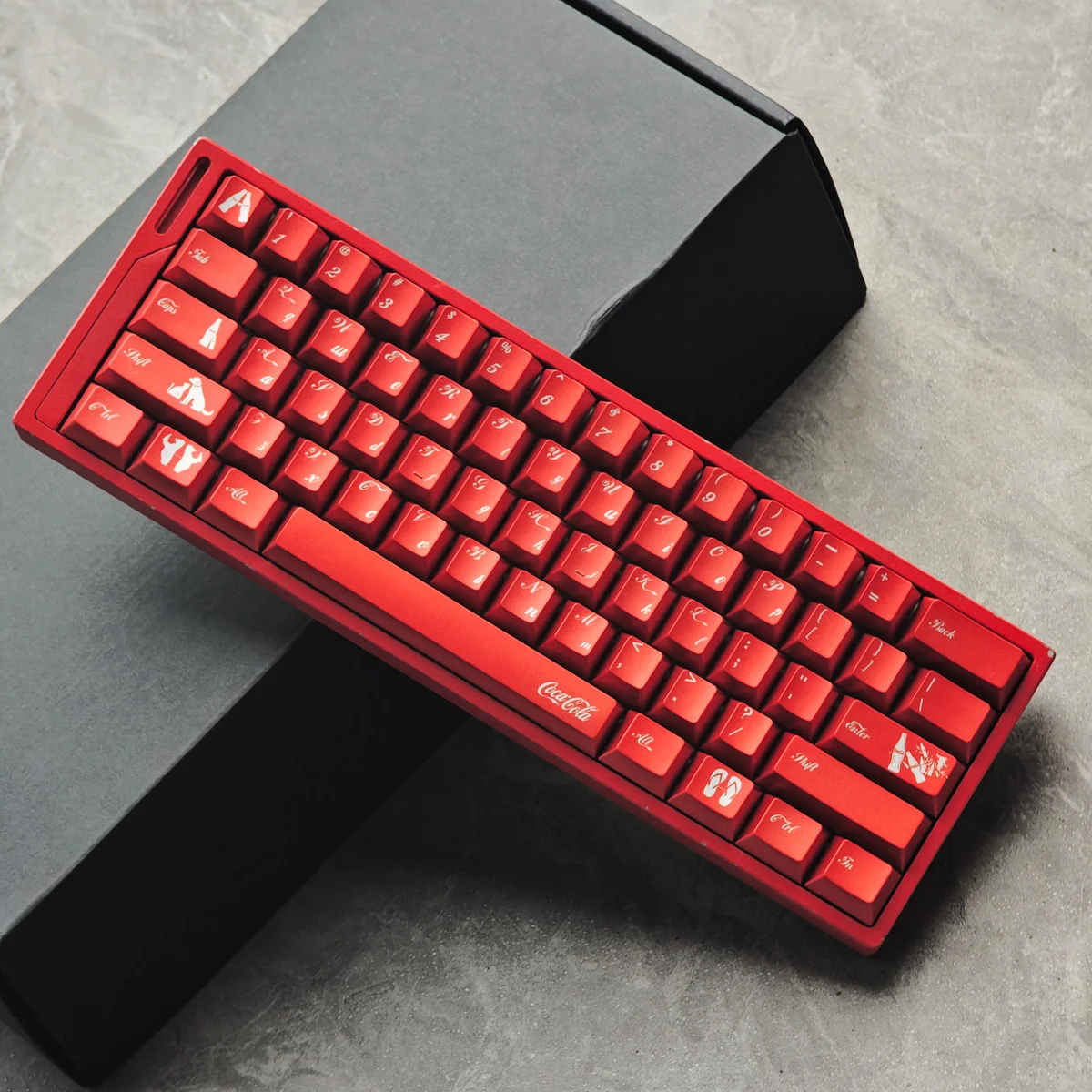 Detailed shot of Cola PBT keycaps, revealing their vibrant red and white retro metallic charm and durable dye-sub legends for mechanical keyboards.