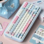 Playful Cowboy Sweetheart PBT Cherry profile keycaps in whimsical blue and pink, showcasing their distinctive western design from a charming perspective.