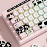 R66 MuMu Dairy Cow custom mechanical keyboard, hot-swappable and triple-mode, featuring its charming pink and white cow-themed design with vibrant color.