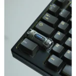 Handcrafted Enriched Uranium Sample resin keycap, revealing its unique post-apocalyptic glow and rugged tactical design from a distinct angle.