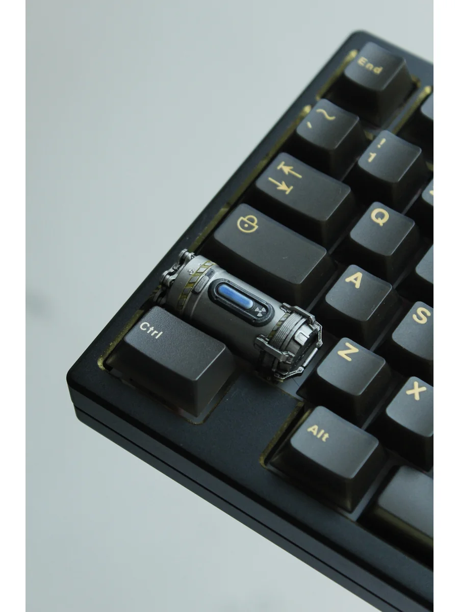 Handcrafted Enriched Uranium Sample resin keycap, revealing its unique post-apocalyptic glow and rugged tactical design from a distinct angle.