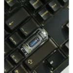 Close-up of a handcrafted Enriched Uranium Sample resin keycap, highlighting its rugged tactical design and post-apocalyptic radioactive glow as a unique keyboard.