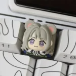 A detailed close-up of the unique hand-sculpted Mai Xiaowen/Hackclaw animal artisan keycap, showcasing its rugged, weathered texture and artistic character.