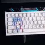 Dynamic close-up of the Demon Slayer Shinobu Kocho Keycap Set, showcasing its vibrant anime art and unique 'messy line' aesthetic from multiple angles.