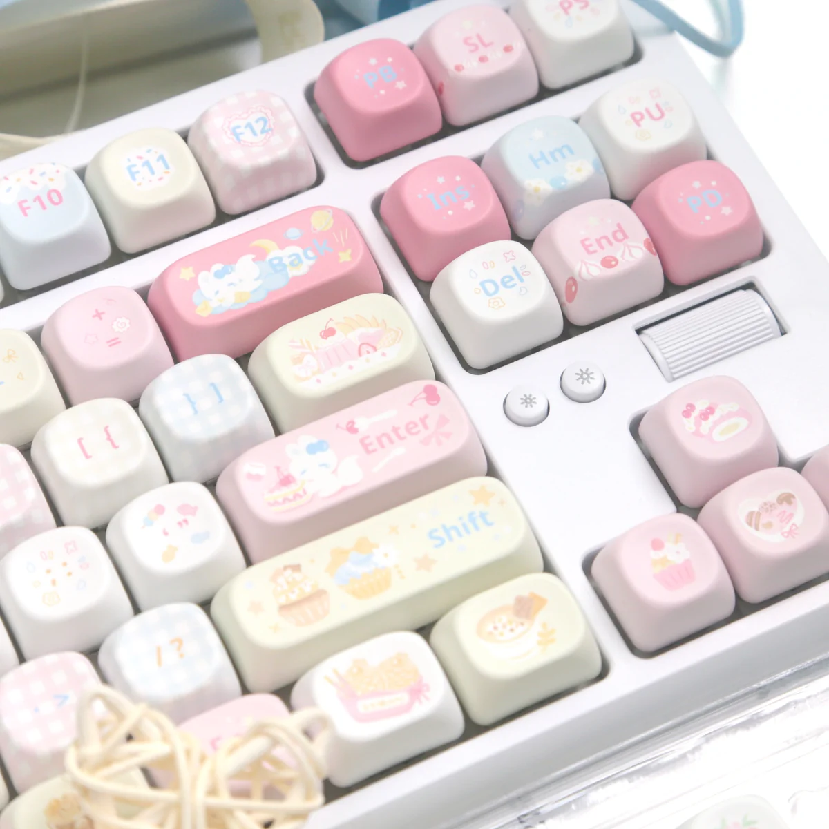 Charming dessert fox PBT MOA keycaps, showcasing their whimsical pastel colors and playful character designs from a delightful angle for joyful typing.