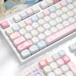 Close-up of the charming Dessert Fox PBT MOA keycap set, showcasing whimsical pastel characters and delightful details for a joyful typing experience.