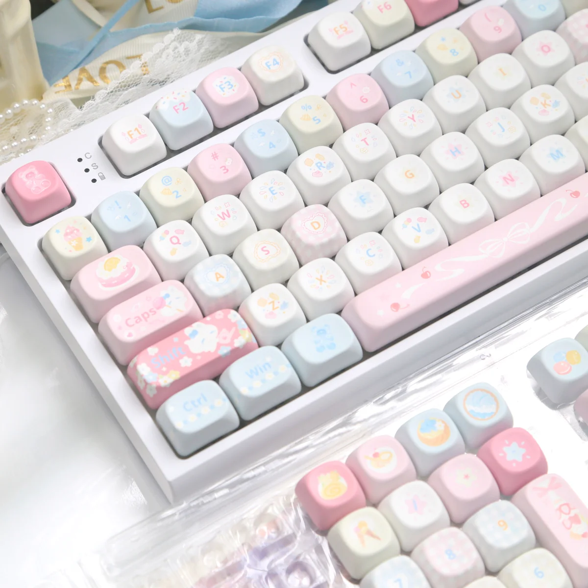 Close-up of the charming Dessert Fox PBT MOA keycap set, showcasing whimsical pastel characters and delightful details for a joyful typing experience.
