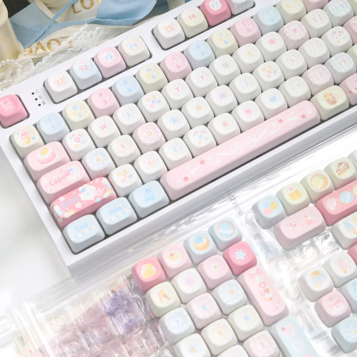 Charming Dessert Fox PBT MOA Keycaps set displayed, featuring whimsical fox characters in soft pastel colors for joyful typing.