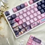 Elaina Keycaps Wandering Witch PBT backlit set, showcasing vibrant anime designs and crisp dye-sublimated legends from a detailed angle.