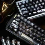 Iconic Final Fantasy VII Sephiroth Cloud PBT side-engraved keycaps from various angles. Features subtle character motifs and a sophisticated metallic finish.
