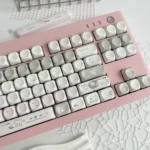Elegant French Dream PBT MOA Keycaps Set gallery displaying various angles, highlighting their soft pastel hues, delicate vintage French patterns.