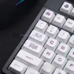 A vibrant set of PBT XDA gaming keycap set, playfully designed with retro pixel art, displayed from various angles. Enhances any gaming setup.
