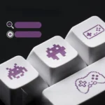 Vibrant PBT XDA gaming keycaps set, featuring playful retro pixel art designs shown from multiple angles, ideal for enhancing any mechanical keyboard.