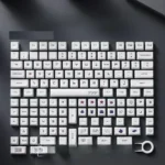 A vibrant collection of PBT XDA gaming keycap set, showcasing playful retro pixel art designs from different angles. This set brings a nostalgic arcade.