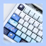 Kamisato Ayaka Genshin Impact MDA PBT keycaps set displayed from multiple elegant angles, showcasing the exclusive ice-themed design.