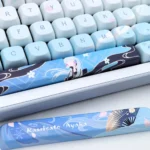 A collection of Kamisato Ayaka Genshin Impact MDA PBT keycaps, shown from multiple angles, highlighting the exclusive elegant ice-themed design.