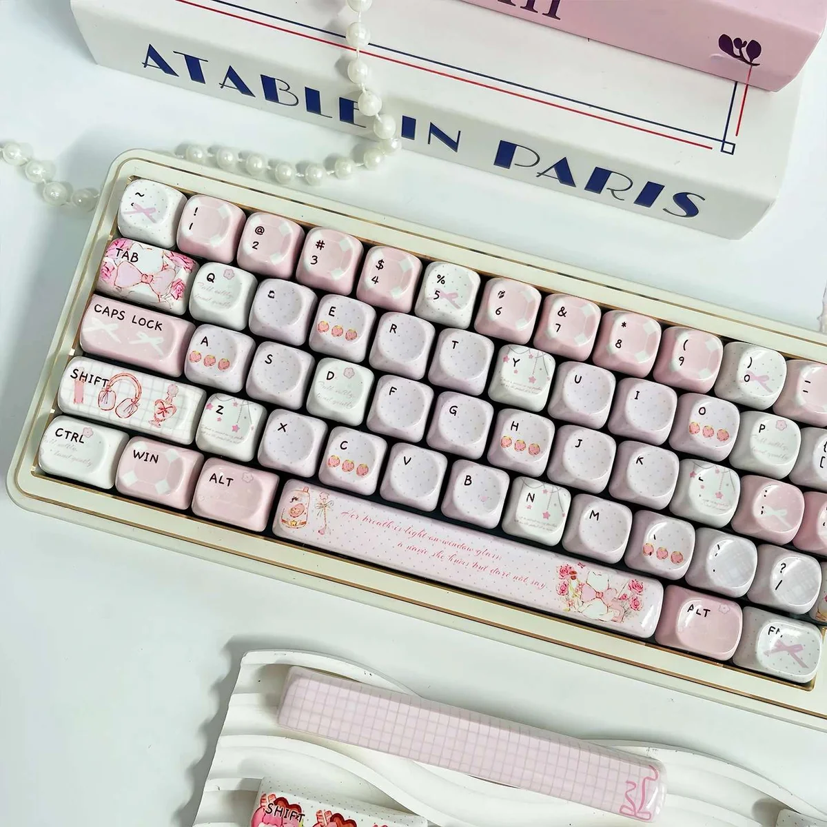 A serene product image collection of Gentle Landing MOA PBT keycaps, highlighting their unique profile and ethereal glazed finish from various angles/