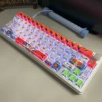 Premium Gundam Kyrios translucent PBT keycap set, exquisitely detailed mecha design visible from multiple angles, enhanced by futuristic lighting.