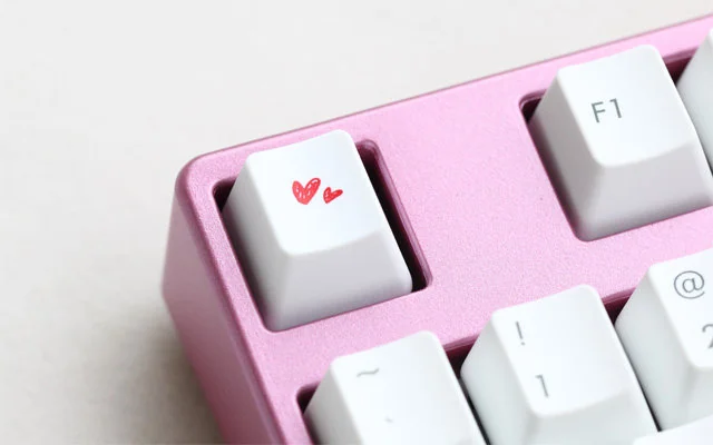 Charming dual-heart PBT keycap with vibrant dye-sublimated graphics. Highlights durable PBT texture and clean lines. A premium heart PBT keycap.