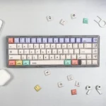 Hello World PBT dye-sub keycaps in a crisp, minty fresh set. This main image showcases the durable retro-tech design, evoking nostalgic programming.