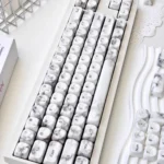 Close-up of the Jade Marble MOA PBT Keycaps Set showcasing the exquisite jade-like PBT material and elegant marble texture from an oblique angle.