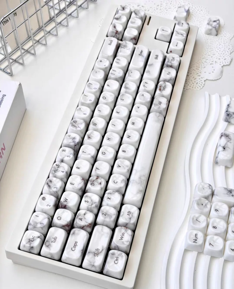 Close-up of the Jade Marble MOA PBT Keycaps Set showcasing the exquisite jade-like PBT material and elegant marble texture from an oblique angle.