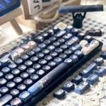 Multiple angles of the premium Jujutsu Kaisen PBT dye-sub keycap set, highlighting vibrant anime art and dark fantasy symbols on MOA profile keys.