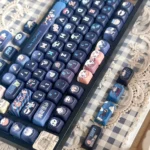 Authentic Jujutsu Kaisen PBT Dye-sub MOA Profile keycaps. Vibrant anime characters and dark fantasy symbols from various angles.