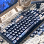 Vibrant, authentic Jujutsu Kaisen PBT Dye-sub Keycap Set in MOA profile, showcasing iconic anime characters and symbols with a dark fantasy aesthetic.