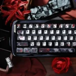 An exquisite view of the Junji Ito Tomie Metallic PBT Keycap Set, highlighting the iconic eerie beauty of Tomie's artwork and its distinct.