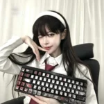 Close-up of the Junji Ito Tomie metallic PBT keycap set, showcasing the eerie beauty of Tomie's iconic artwork and the premium metallic finish.