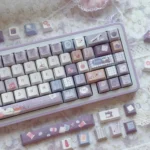 The Little Tailor Artistry PBT Tailor Keycap Set displayed from various angles, revealing its charming, intricate details and the premium durable PBT.