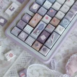 Little Tailor Artistry PBT Tailor Keycap Set, showcasing its unique charming motif and meticulous details on durable PBT texture.