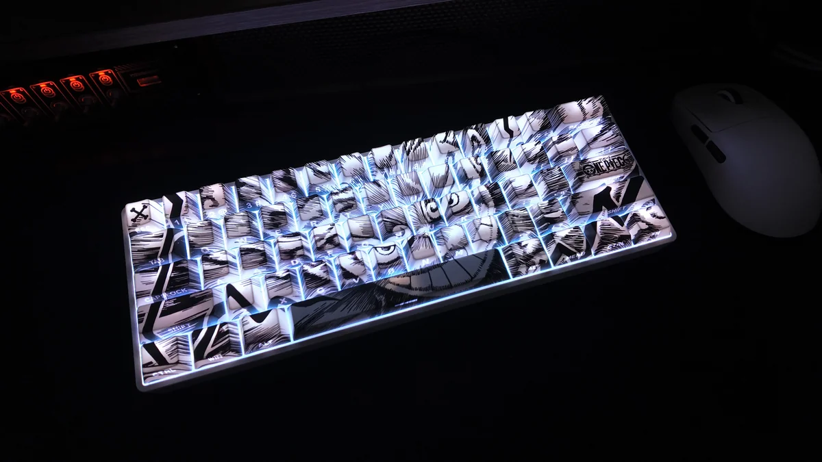Dynamic shots of the premium One Piece Luffy side-engraved PBT backlit keycap set, highlighting its vibrant, light-transmitting legends.