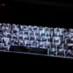 Dynamic shots of the premium One Piece Luffy PBT backlit keycap set, featuring its unique side-engraved legends and vibrant, light-transmitting design.